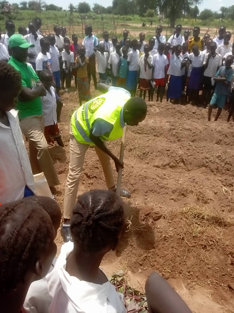 NPG team and community members at a groundbreaking ceremony
